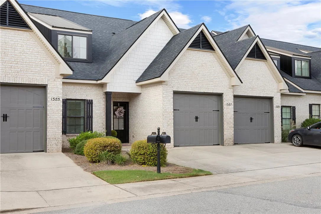 Distinctive architectural rooflines and classic brick exteriors define this stylish townhome design.