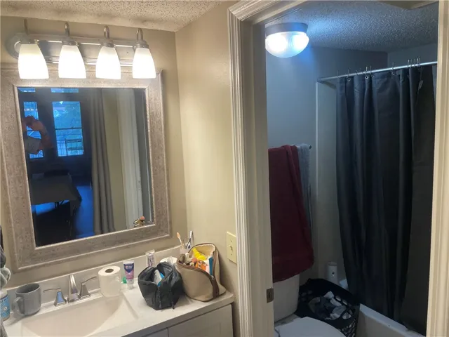 A well-appointed bathroom vanity with a spacious mirror provides both utility and aesthetic appeal.