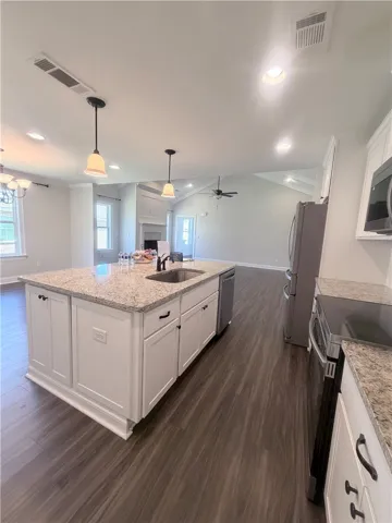 Cabinets all around the large island