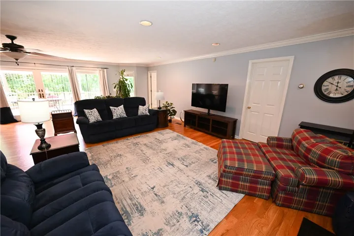 Inviting great room streaming with natural light! Door in far back leads to primary suite while foremost door leads to the primary's private study (or other flex space).