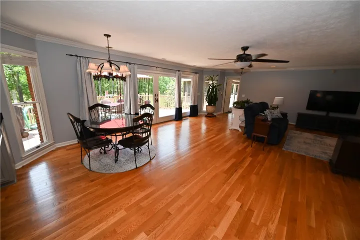 Breakfast area & great room share wall of windows & doors overlooking the back deck, yard, & lake!