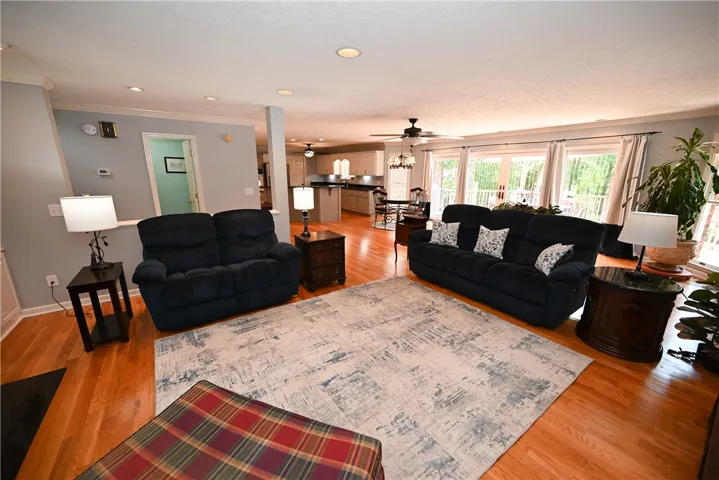 Spacious great room with breakfast area & kitchen in back.