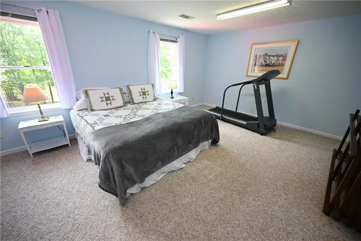 Bed 3 (upstairs) with sitting area & walk-in closet.