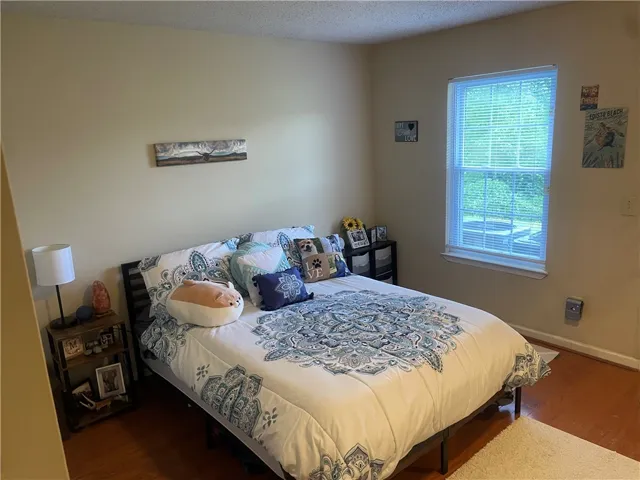 A window brings natural light into this cozy bedroom.