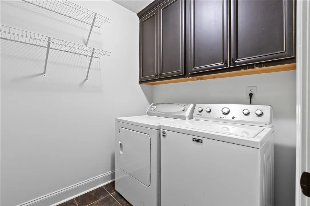 Tile flooring; washer and dryer convey with the home if desired
