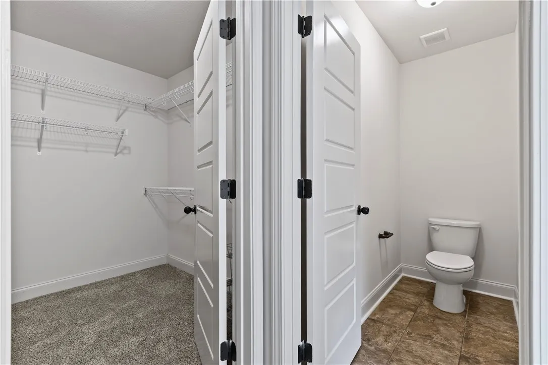 Large walk-in closet and private water closet