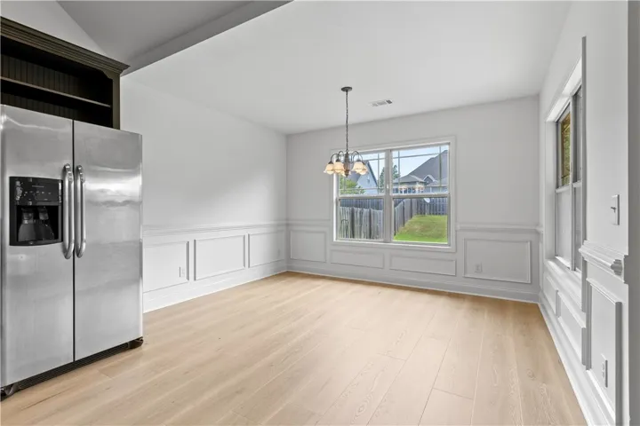 Nice-sized dining area with wainscoting, new LVP flooring