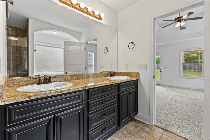 Double vanities,  granite counters, great natural light
