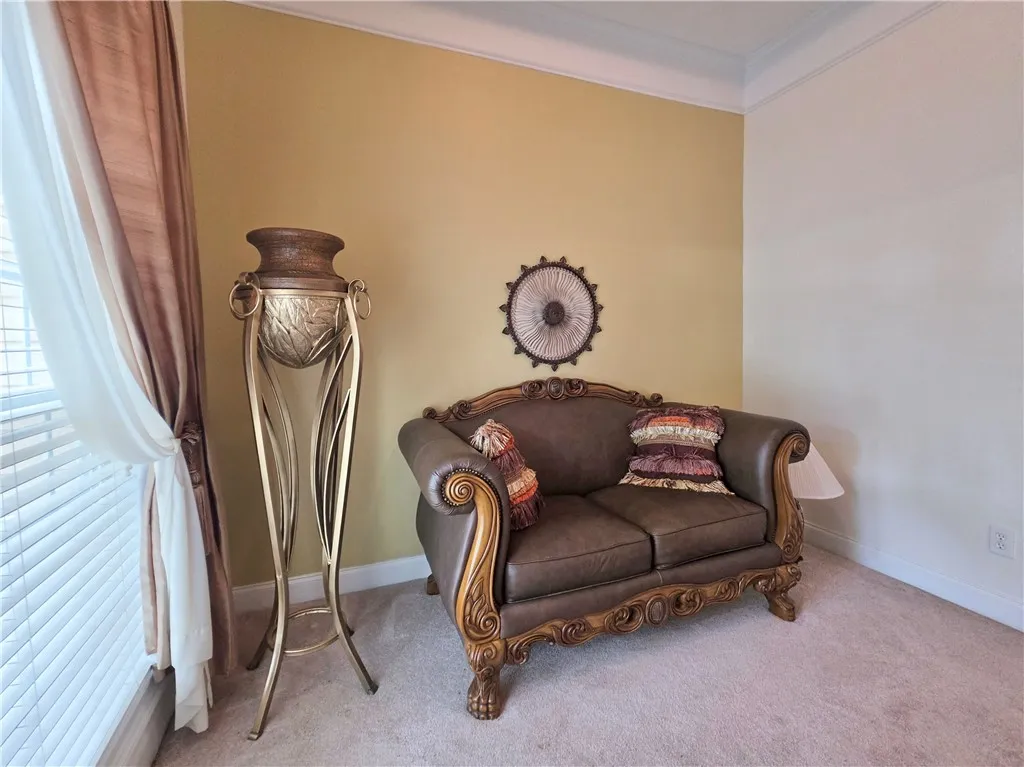 Crisp crown molding accents the high ceilings of this inviting space.