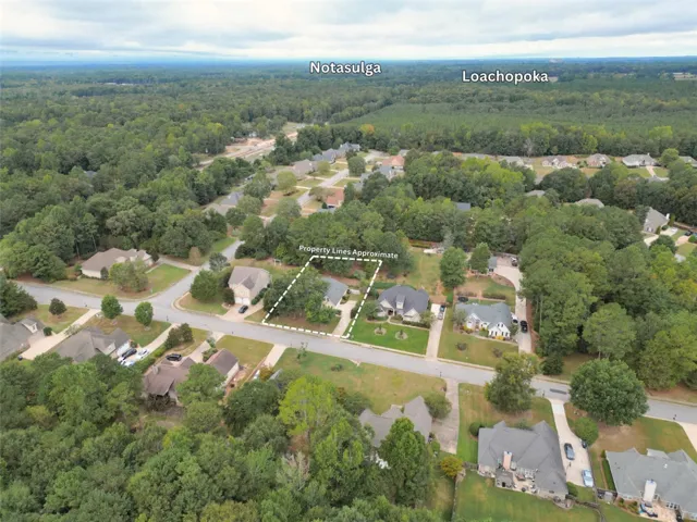 A peaceful suburban neighborhood surrounded by mature trees offers a quiet, established setting.