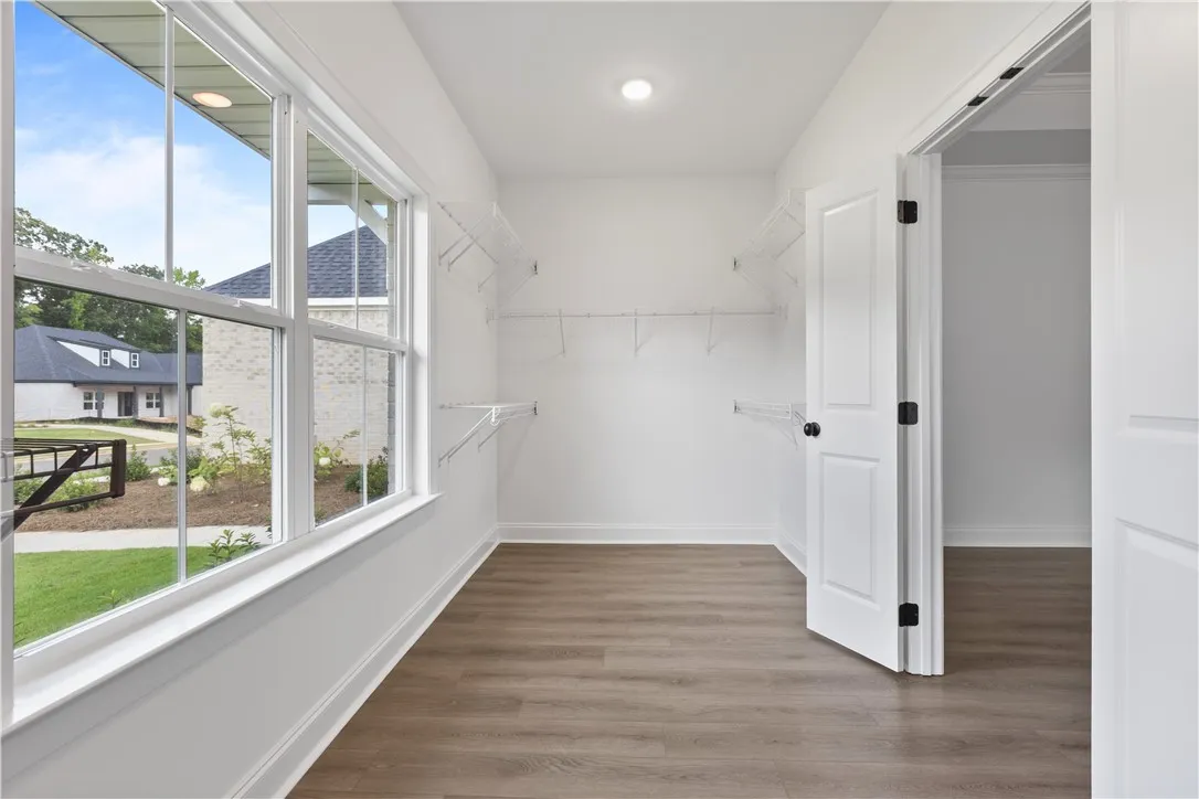 The primary closet has a large window for great light.