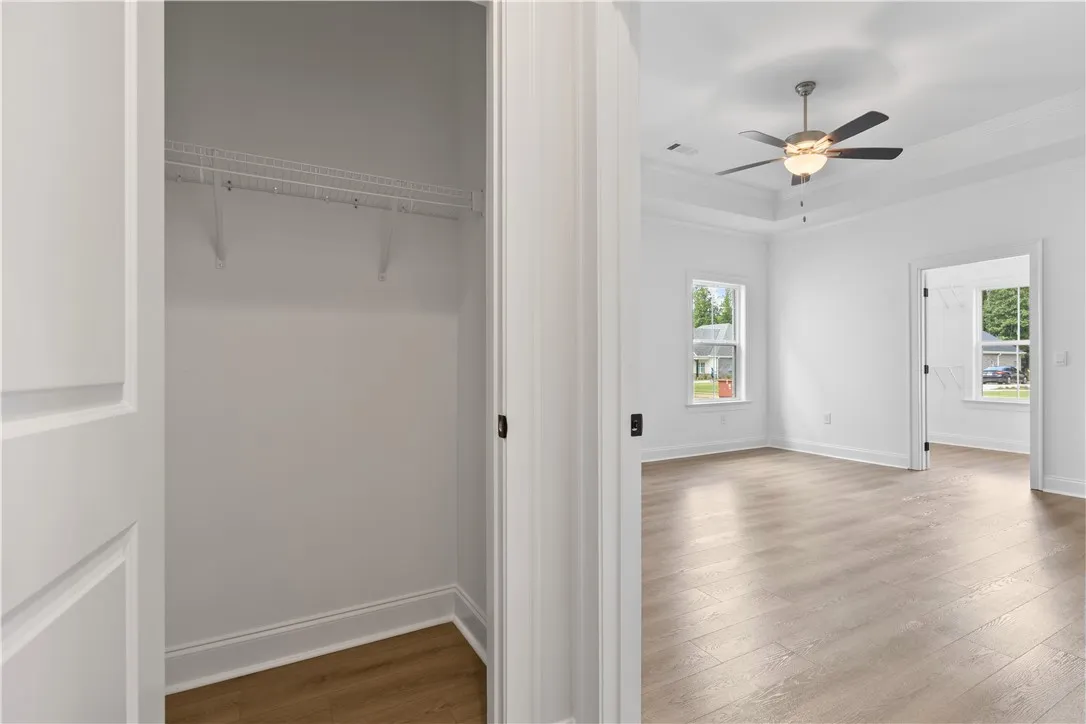 The entry to the main bedroom features a large closet for extra storage.