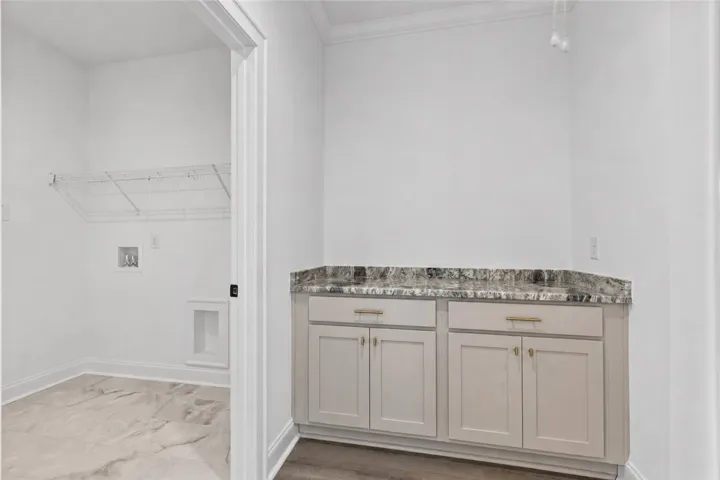 Drop zone features a large area for folding clothes just off the laundry room.