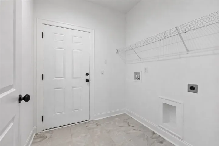 Spacious laundry room just off the garage.