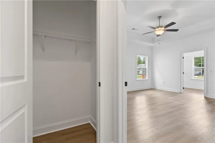 The entry to the main bedroom features a large closet for extra storage.