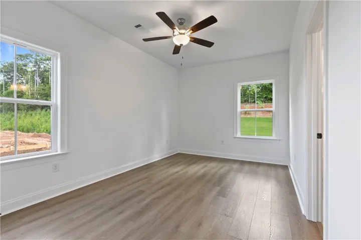 This split floorplan has the three guest bedrooms on the opposite side of the house from the main bedroom. One of the guest bedrooms has it's own ensuite.
