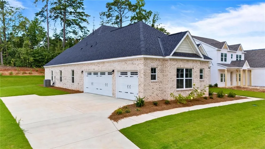 The side-entry to the three car garage has plenty of room for parking and backing out.