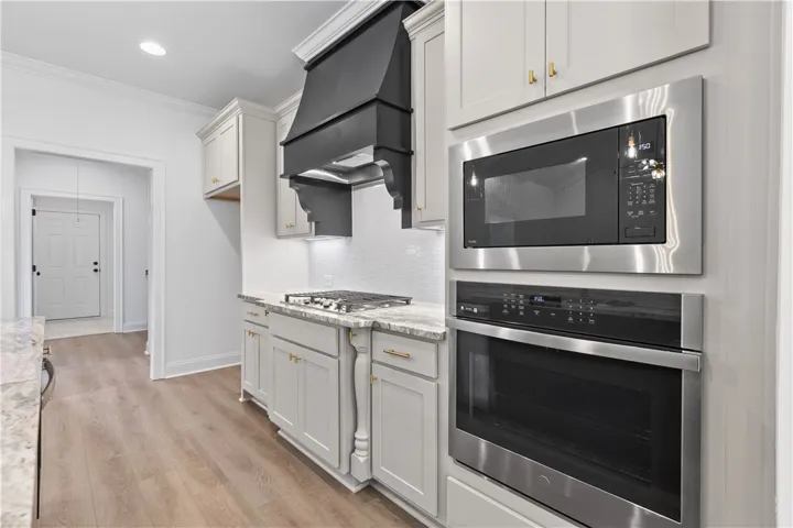 The kitchen has great flow and a fantastic warm color scheme.