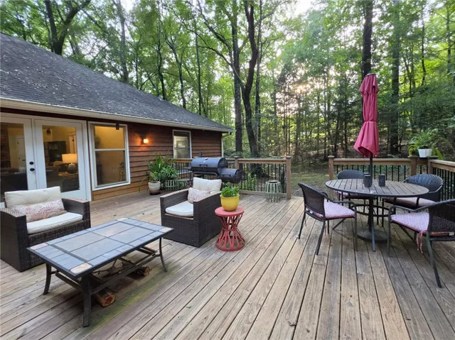 Relax on the back deck & enjoy the natural surroundings!