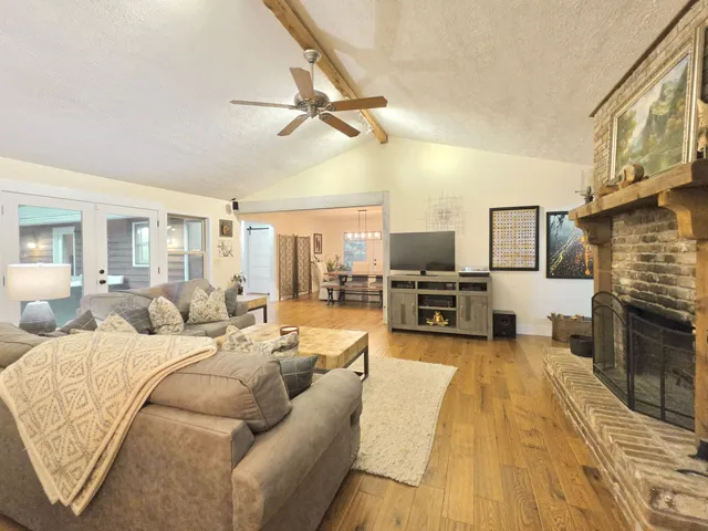 Vaulted Great Room with brick hearth fireplace