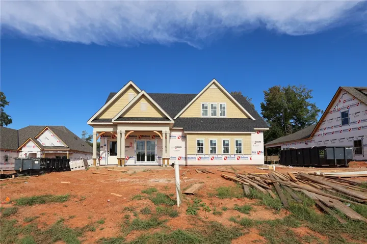 Dual gables and a covered front entry highlight this classic craftsman architectural design.