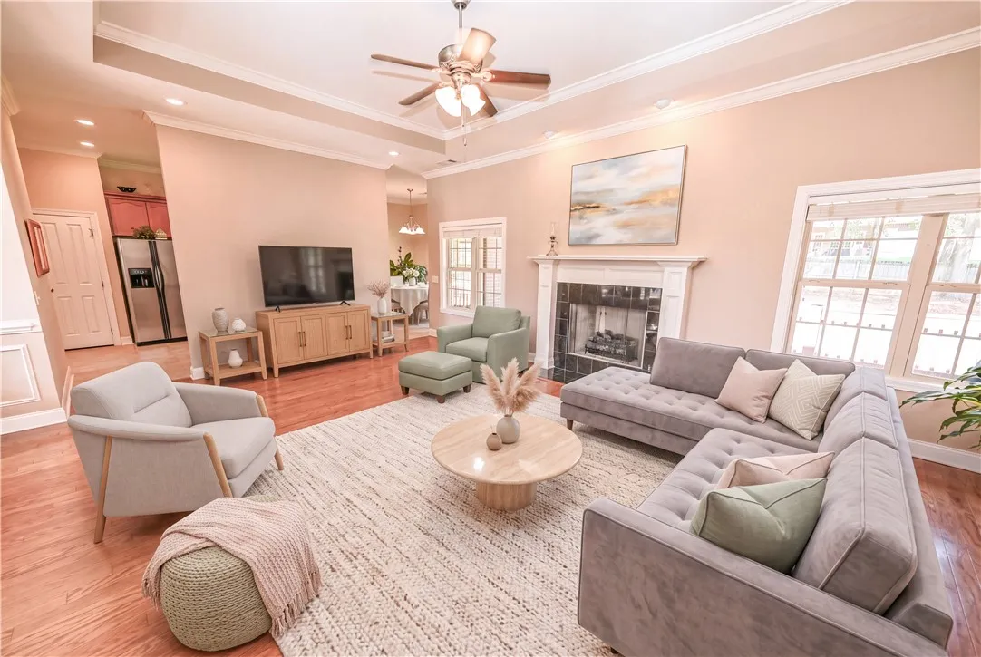 DIGITALLY STAGED Living Room 
The large, open living room invites you in with soft natural lighting.