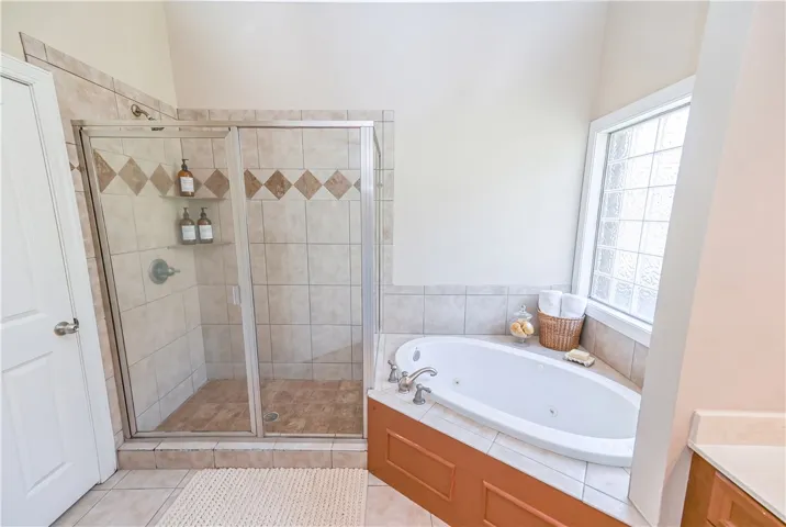 DIGITALLY STAGED Primary Bathroom
Can't forget about the glass/tile shower and soaking tub.