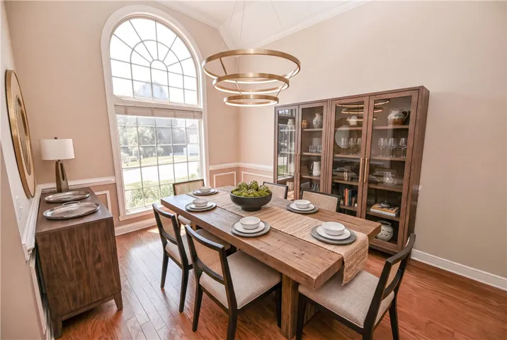 DIGITALLY STAGED Formal dining room
Flowing to the dining room, the level of detail is unmatched.
