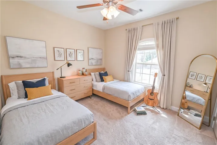 DIGITALLY STAGED Bedroom 2 
On the opposite end of the house lies a roomy second bedroom