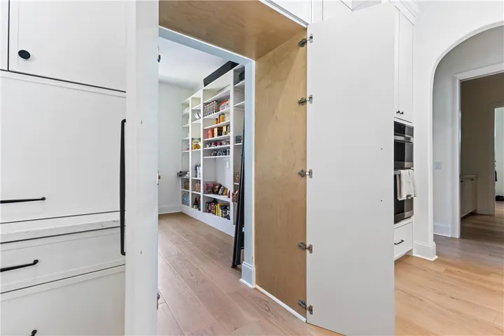"hidden door" entry into the butler's pantry from the kitchen