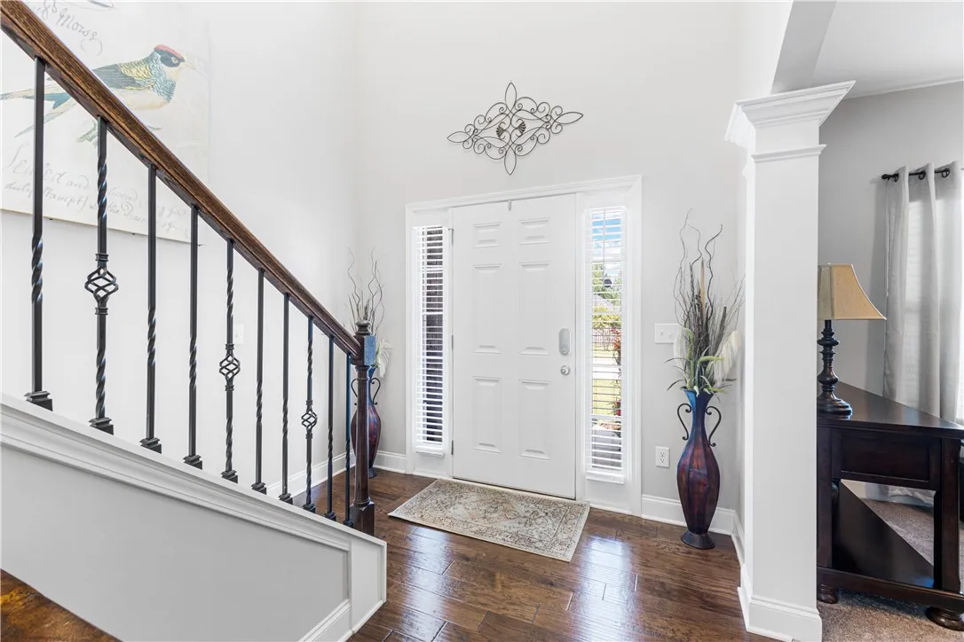 High ceilings and rich hardwood flooring welcome visitors into this elegant entrance​​‌​​​​‌​​‌‌​‌‌​​​‌‌​‌​‌​‌​​​‌​​ foyer.