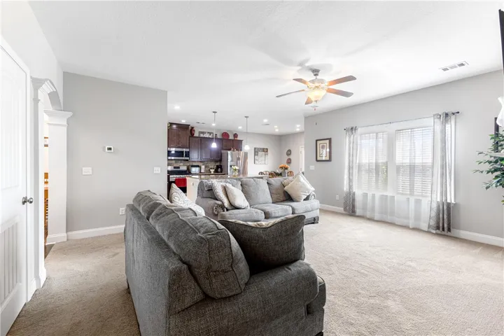 An open floor plan seamlessly connects the living space directly to the kitchen.