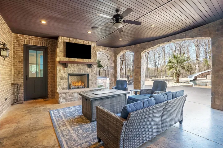Basement level patio with fireplace & TV