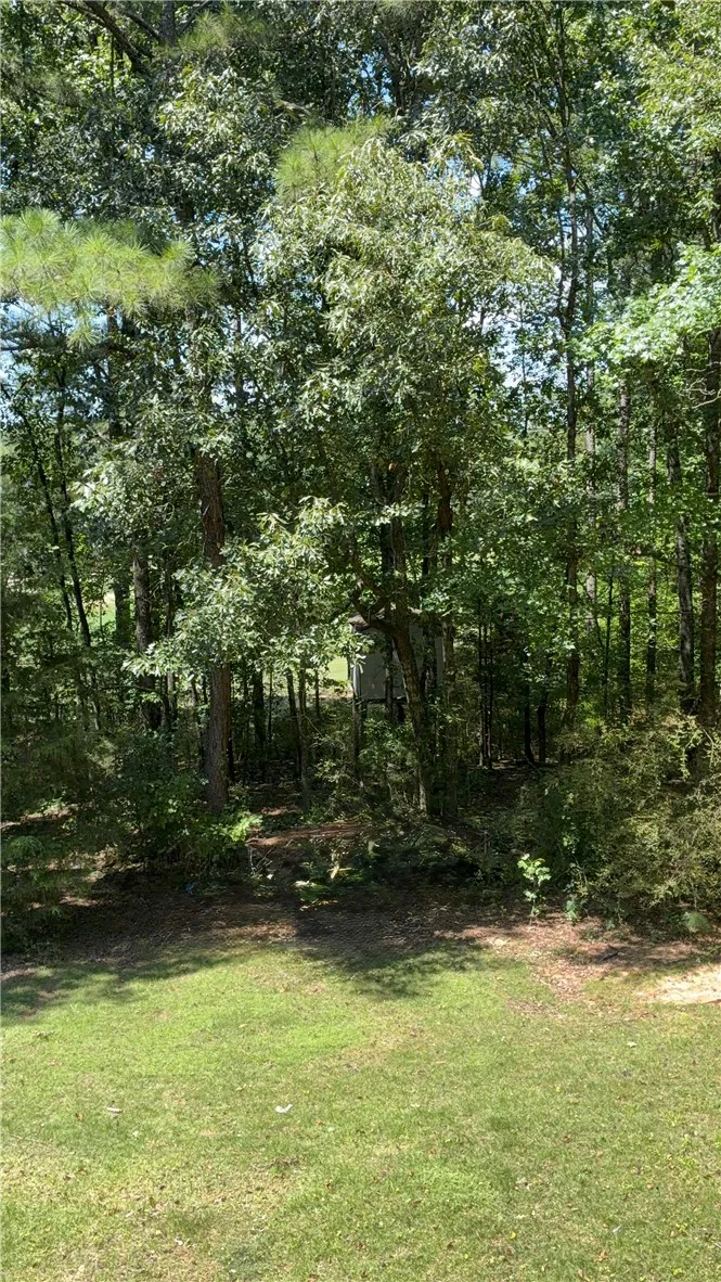 Golf course is just beyond the trees, there was a golf cart trail in yard to access course. You need to check membership rules before playing on course.