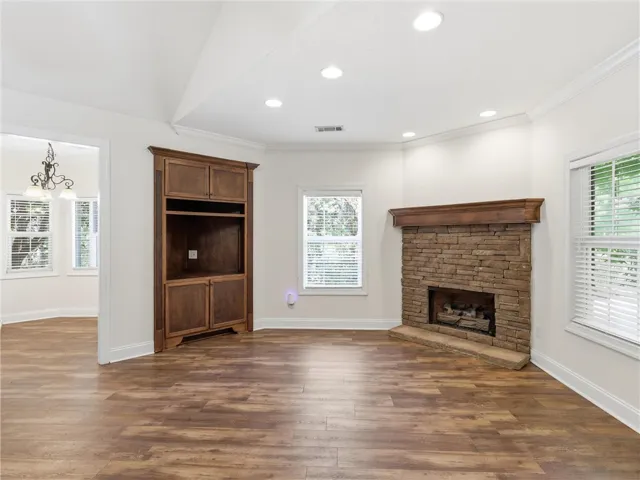 Keeping room off Kitchen with Stone Fireplace & built ins