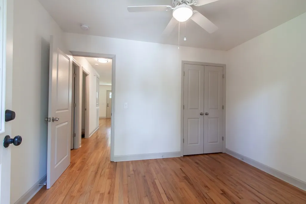 Warm hardwood floors and classic panel doors highlight this versatile interior space.