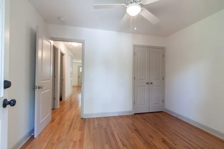 Warm hardwood floors and classic panel doors highlight this versatile interior space.