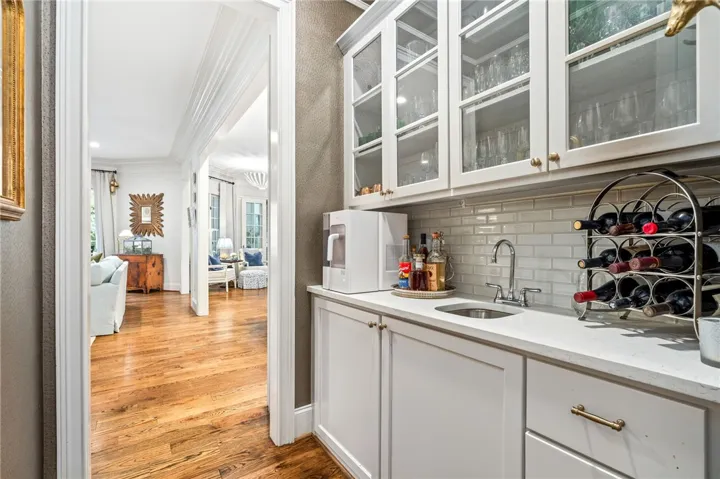 Tasteful Wet Bar between the kitchen and dining room.