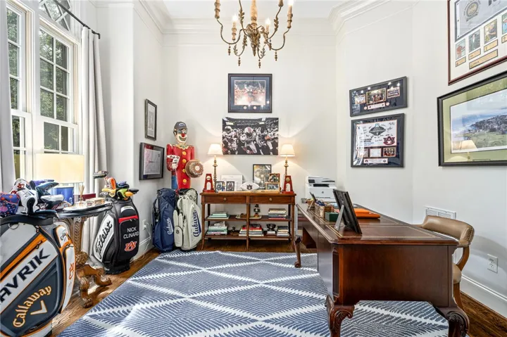 Home office space with cased opening to the left of the foyer.