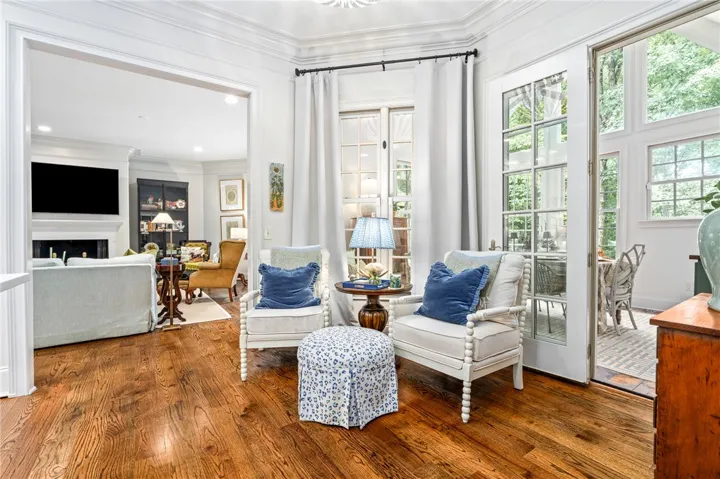 Open, light-filled sitting area adjacent to the kitchen and sunroom.