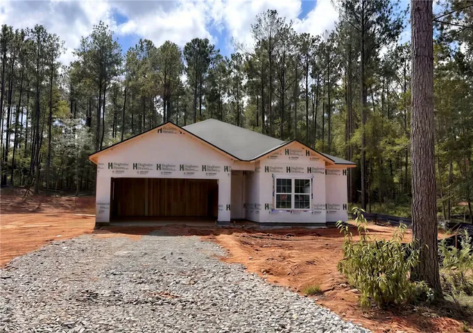 Henry A
Nestled among towering trees, this new construction home begins to take shape.