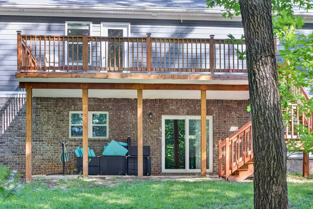 A elevated deck and a ground-level patio provide ample outdoor living space.
