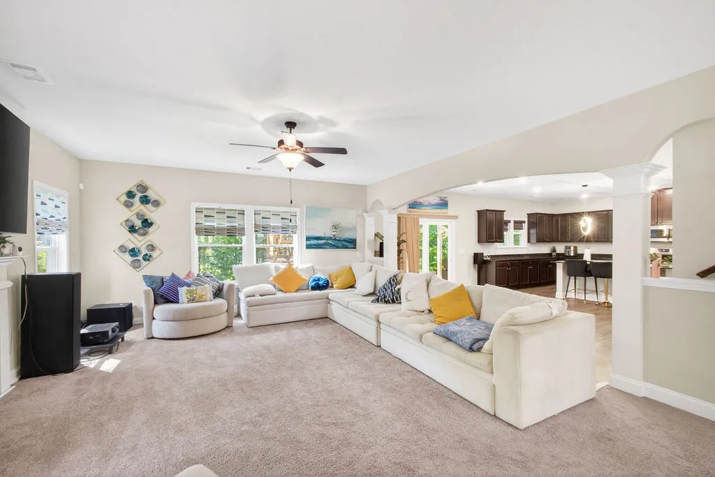 An open floorplan seamlessly connects the living area with a well-appointed kitchen, ideal for entertaining.