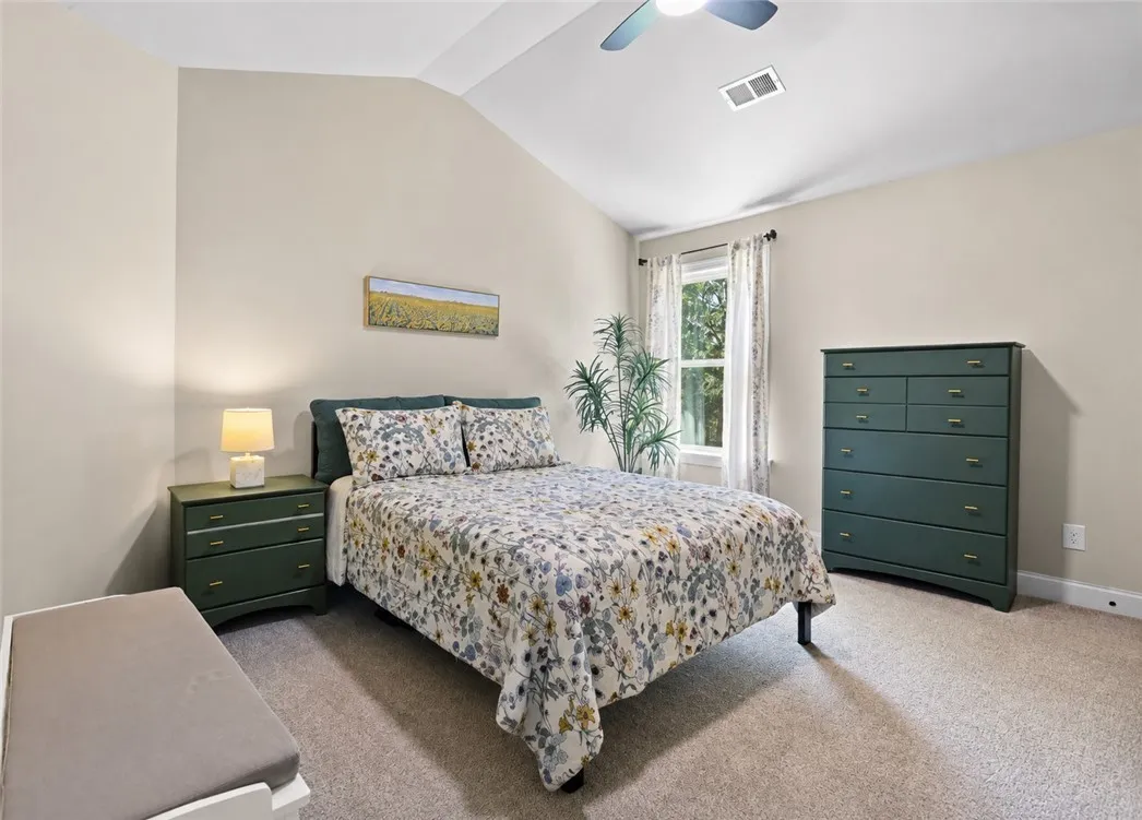 The last upstairs bedroom has a vaulted ceiling, generous wall space and a large closet.