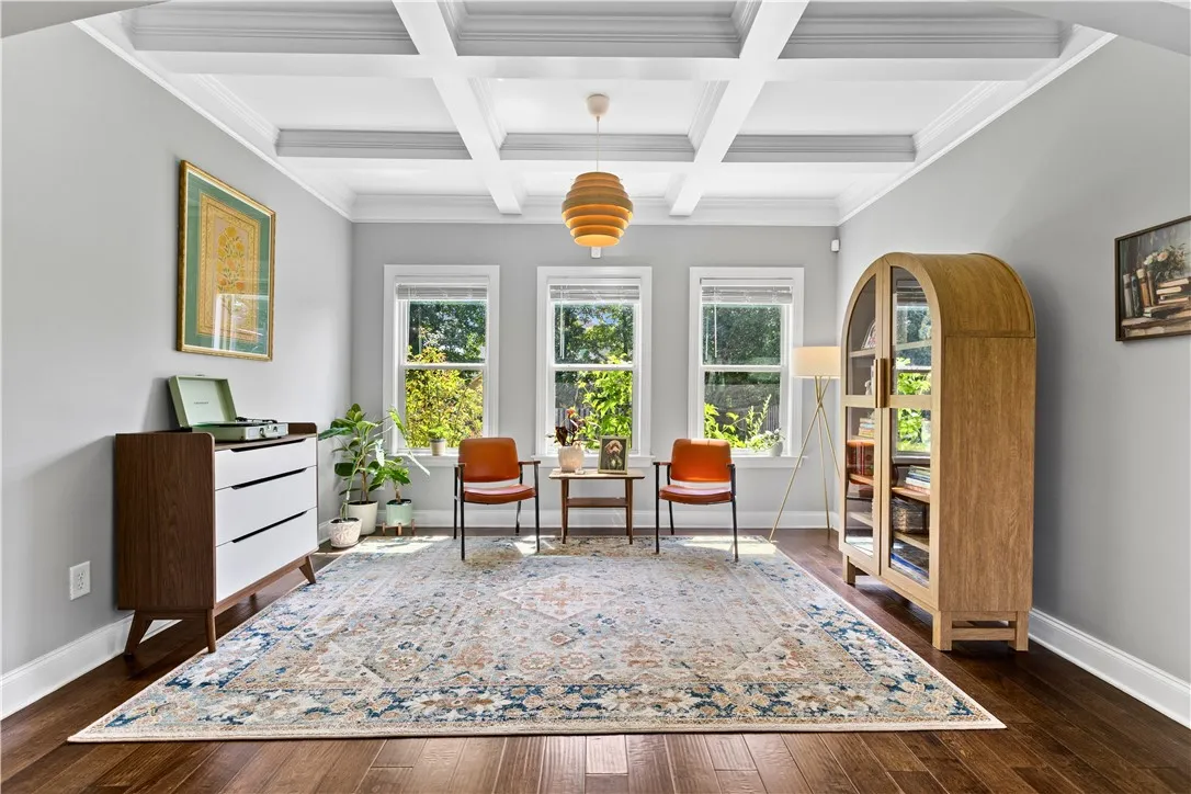 Designed as a dining room but currently enjoyed as a sitting room, this versatile space can easily adapt for whichever you need -with a beautiful coffered ceiling and new light fixture.