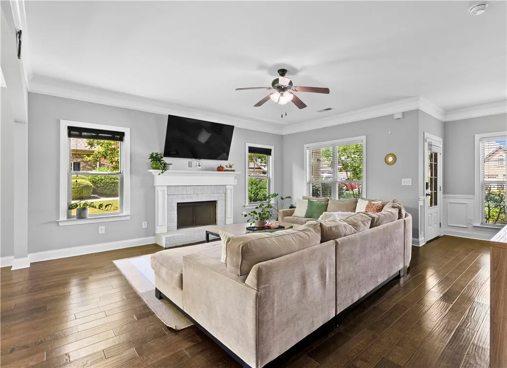 The living room is spacious enough for a  large sectional and coffee table with plenty of space left for walkways.