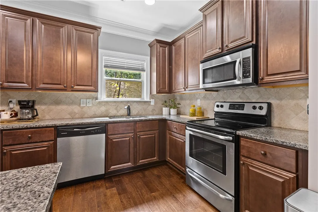 The all electric kitchen has a stove, built-in microwave and plenty of counter space.  The refrigerator will remain with the home.