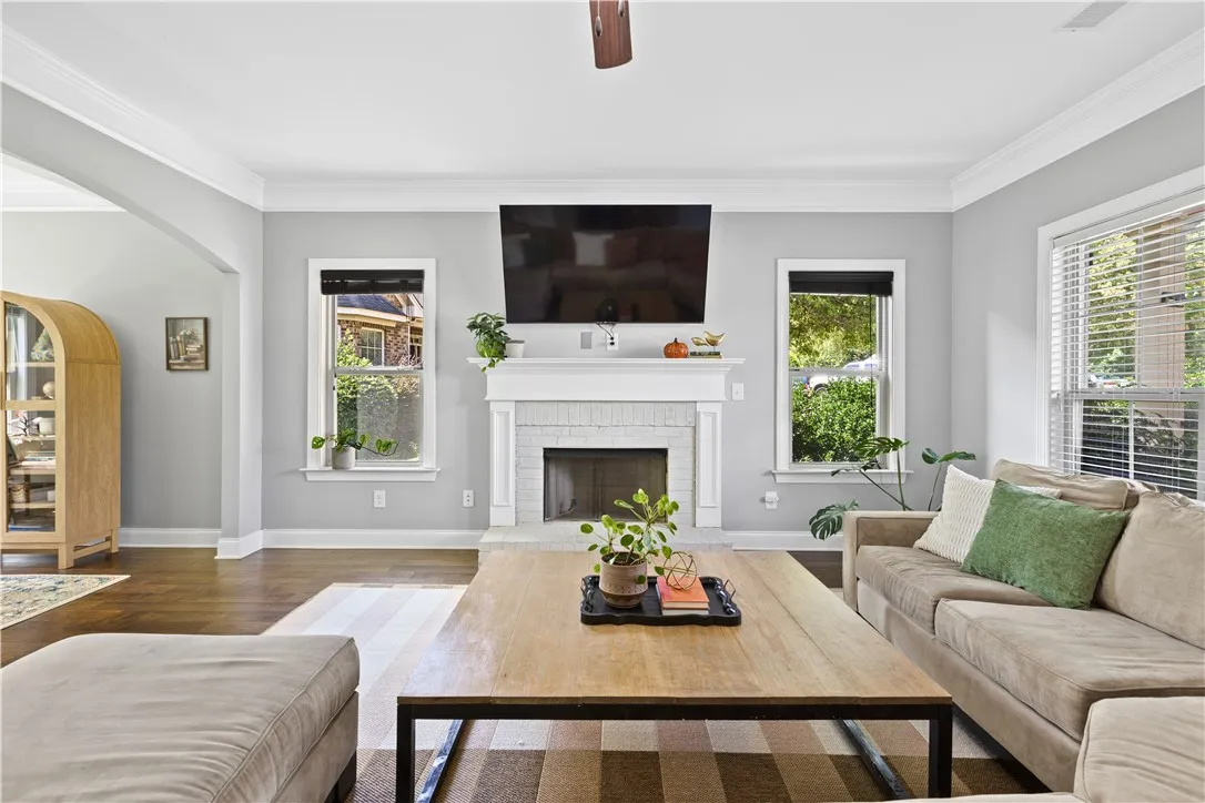 The fireplace anchors the living room creating a cozy feel.  It is wood burning and has an ignitor.