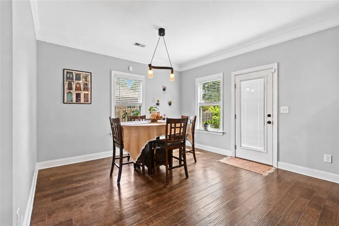 Breakfast area also features access to the backyard and has updated lighting.  This space is large enough to accommodate a large dining table.