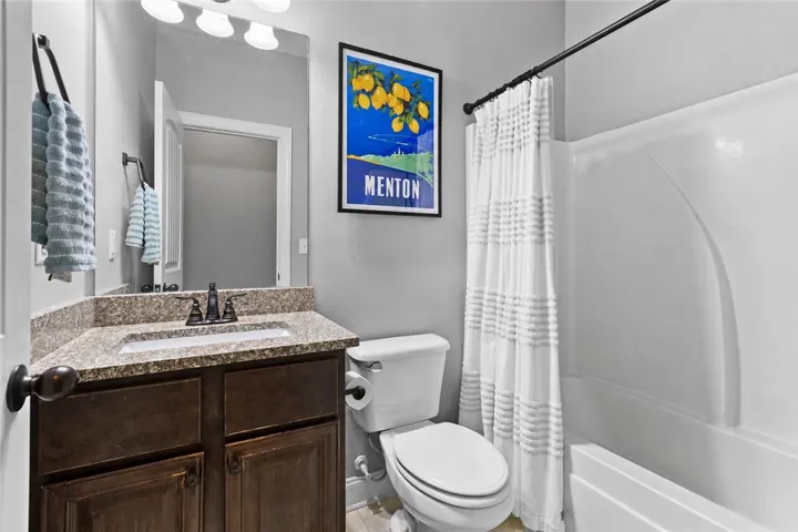The downstairs guest bath is a full bathroom for extra convenience.